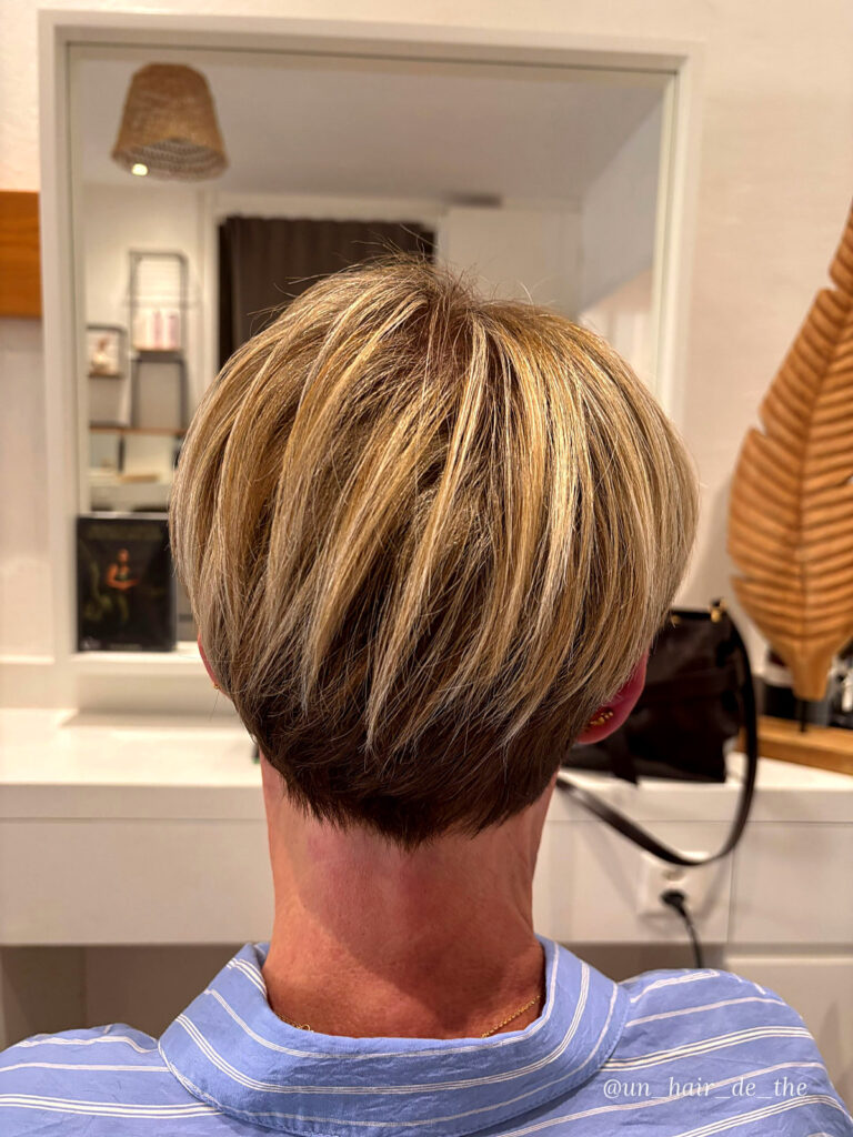 Short layered cut with blonde highlights
